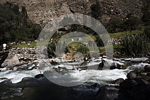 river with crystal clear water and rapids between the rocks and the Amazon jungle