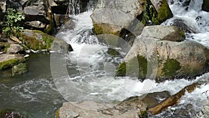 Mountain river. Fast stream moving among rocks.