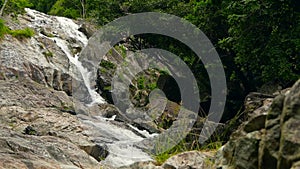 Mountain river flowing in rainforest. Endless meditative video, stream in tropical exotic jungle forest. Creek flow in