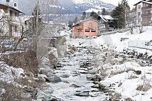 Mountain river in a ski resort in Italy, Alps
