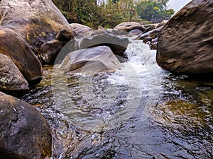 Mountain river flowing thrugh rocks. photo