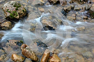 Mountain river flows over the rocks