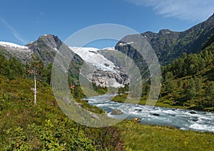 Mountain river formed by meltwater of glacier