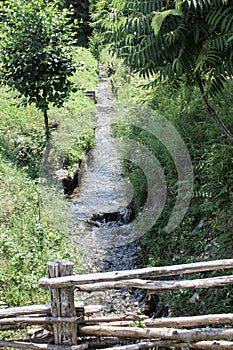 Mountain river and green scenery. Transfagarasan road. Romania