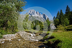 Mountain river in the Klausbachtal, in the background the impressive peaks of the Reiteralm, Ramsau, Bavaria, Germany