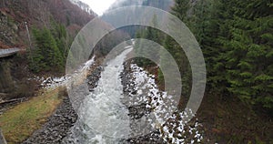 Mountain river with large stones in the mountains