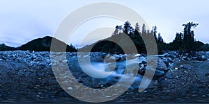 Mountain river in the middle of the forest at the blue hour on a long exposure. Spherical panorama 360vr