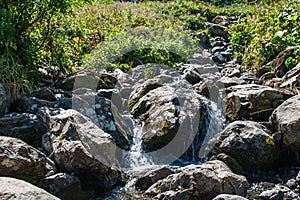 Mountain river or pretty stoney creek on Alps. Mountain natural landscape