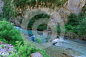 Mountain river between sheer cliffs . blue clear water of the river.