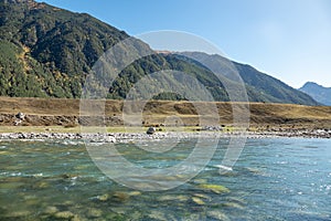 mountain river between sheer cliffs . blue clear water of the river