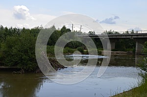 The mountain river with stones ashore