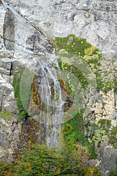 Mountain river stream waterfall on the rock