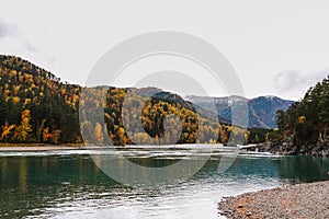 Mountain river surrounded by high rocks in Altai