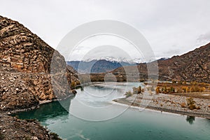 Mountain river surrounded by high rocks in Altai