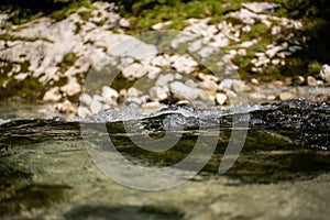 Mountain river water landscape - a refreshing and cold mountain river near a hiking trail in the bavarian alps