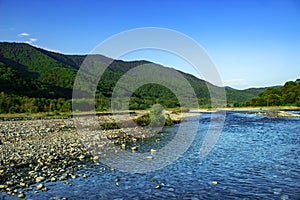 Mountain river water landscape. Wild river in mountains. Mountain wild river water view.