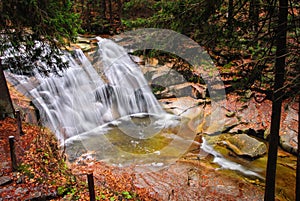 Mountain river waterfall in autumn