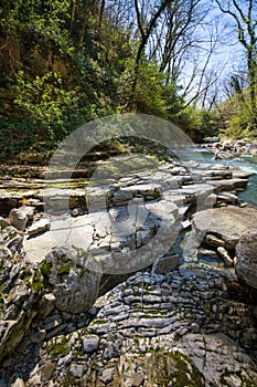 The mountain river with waterfall