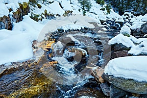 Mountain river on wintertime photo