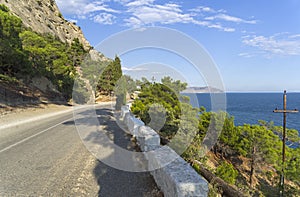 A mountain road along the seashore.