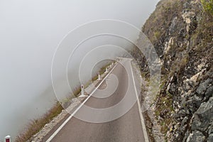 Mountain road in clouds photo