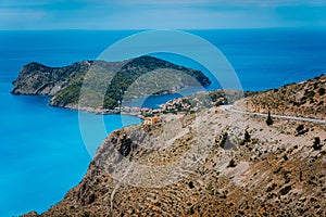 Mountain road leading to famous Assos village and venetian fortress, great landscape of Kefalonia island, Greece. Vacation summer