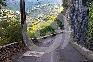 Mountain road that leads directly along a cliff photo