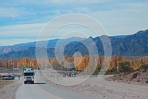 Mountain road from Mendoza to Santiago with autumn