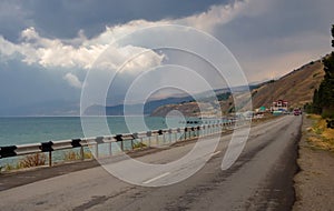 Mountain road near the sea in the Crimean mountains in summer.