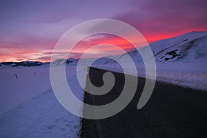 Mountain road in the Pian Grande during romantic dusk photo