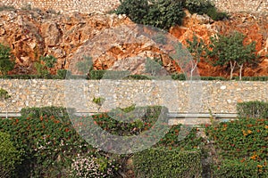 mountain road on a rocky slope in Alanya, beautiful ornamental plants, Turkey. photo