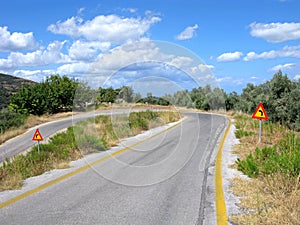 Mountain road, sharp turn, road signs