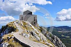 Mountain road to ancient mausoleum. Beautiful scenic landscape. Stairs to heaven concept