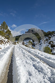 Mountain road to La Serrella (1.359 m) mountain in winter.