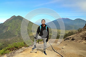 On a mountain road trecking to the Ijen volcano or Kawah Ijen on the Indonesian language. Famous volcano containing the