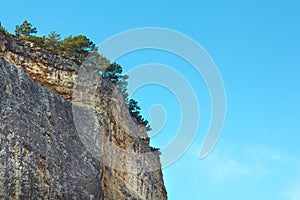 Mountain, a rock against the blue sky.