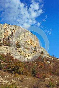 Mountain, a rock against the blue sky.