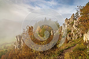 Mountain rocky landscape in autumn foggy morning