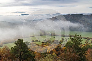 Mountain rocky landscape in autumn foggy morning