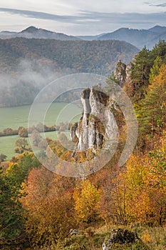 Mountain rocky landscape in autumn foggy morning