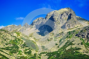 Mountain rocky peaks on a blue sky