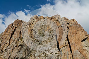 Mountain rocky wall of Tian Shan peaks in Tuyuk-Su