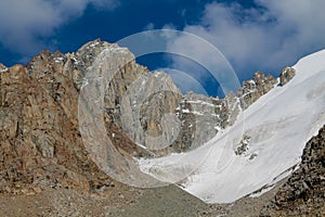 Mountain rocky wall of Tian Shan peaks in Tuyuk-Su