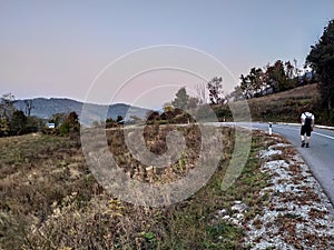 Mountain Rudnik Serbia Ostrovica pawed road and a hiker