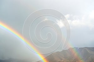 Mountain scenery with double rainbow