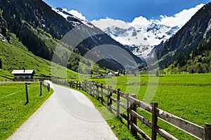 Mountain scenery way and wooden fence in Stilluptal Mayrhofen Austria Tirol photo