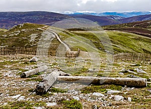 Mountain in the Scottish Highlands, situated about 3 km to the west of Tyndrum featuring fencing and what appears to be a broken p