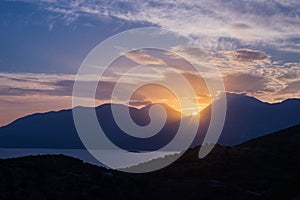 mountain and sea landscape with a sunset