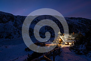 Mountain shelter Samotnia in Karkonosze during  winter night in Poland