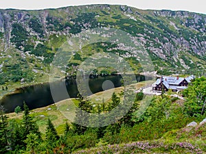 Mountain shelter Samotnia over MaÅ‚y Staw pond in Sudetes.